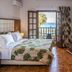 Georgalas Sun Beach Resort room with balcony doors open to sea view in Nea Kallikratia