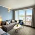 Isabella Island Hotel & Villas, Poreč guest room with sofa, bed, balcony and sea view