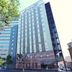 Hotel Route-Inn Oita Ekimae in Ōita, tall exterior with tree-lined street view