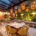 Hotel El Marqués by Faranda Boutique in Cartagena restaurant with hanging lanterns and lush green wall