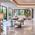 Fisherman Way Beach Villa, Rawai: bright villa lounge with marble floor, curved staircase, and garden views