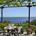 Hotel Agnadi - Horefto terrace with table and chairs overlooking the sea in Chorefto