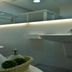 Xin Qun Style Hostel bathroom with sink, mirror, towel rack, and basket of toiletries in Luodong Township