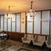 Allegro Hotel Goiânia lobby with glass table, chairs, chandeliers and armchairs