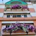 Sandy Serviced Apartment in Bangkok with balconies overflowing with purple and white flowers