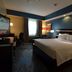 Fairfield Inn & Suites by Marriott Houston North/Spring guest room with king bed, TV, and window seating