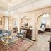 Elegant suite at Taj Fateh Prakash Palace Udaipur with ornate seating, chandelier, and bedroom views