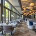 Europäischer Hof in Baden-Baden: elegant hotel restaurant with large windows and hanging globe lights
