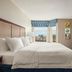Hampton Inn & Suites Ft. Wayne-North guest room with king bed, TV, and city view in Fort Wayne