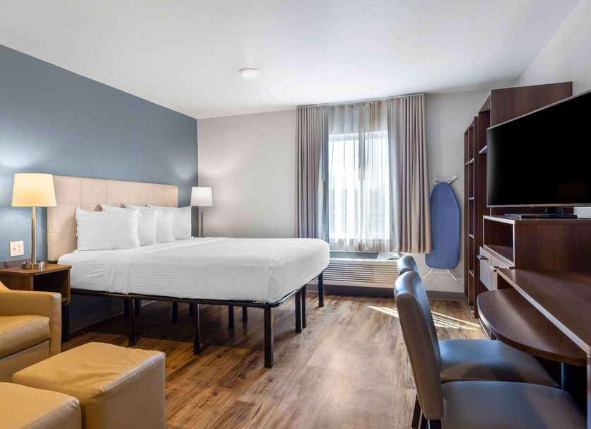 Extended Stay America Suites - Boston - Saugus guest room with king bed, desk, TV and armchair