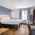 Extended Stay America Suites - Boston - Saugus guest room with king bed, desk, TV and armchair