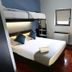 Inani Hotel Morning Star Pretoria room with bunk bed, double bed, desk and window