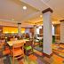 Fairfield Inn and Suites by Marriott Williamsport breakfast area with colorful carpet and seating