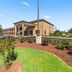 Americas Best Value Inn Byhalia exterior with landscaped grounds and covered entrance