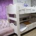 Time Motel Gyeongju bunk bed room with white bunk bed, ladder, and pink sofa
