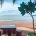 Sri Phairin Resort in Chanthaburi with beachfront table and stools facing the sea