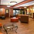 Holiday Inn Express & Suites Dayton-Centerville in Centerville lobby with seating area and front desk