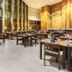 Sonesta Hotel Osorno restaurant dining area in Osorno with set tables and tall windows