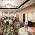 Hilton Garden Inn Winchester banquet room with round tables and chairs