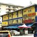 Sun Inns Hotel Lagoon in Petaling Jaya exterior with street-level shops and parking sign