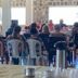 Beach Hotel Jacuma in João Pessoa with guests seated for an indoor gathering and speaker at the front.