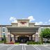 Hampton Inn Turlock exterior with covered entrance and parking lot in Turlock