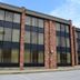 Jameson Inn Bowling Green brick hotel exterior with large windows and parking lot