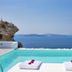 Villaki Oia in Oia: infinity pool with loungers overlooking the sea and distant islands