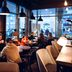 Original Sokos Hotel Vaakuna Joensuu café lounge with guests seated at tables and pendant lights in Joensuu