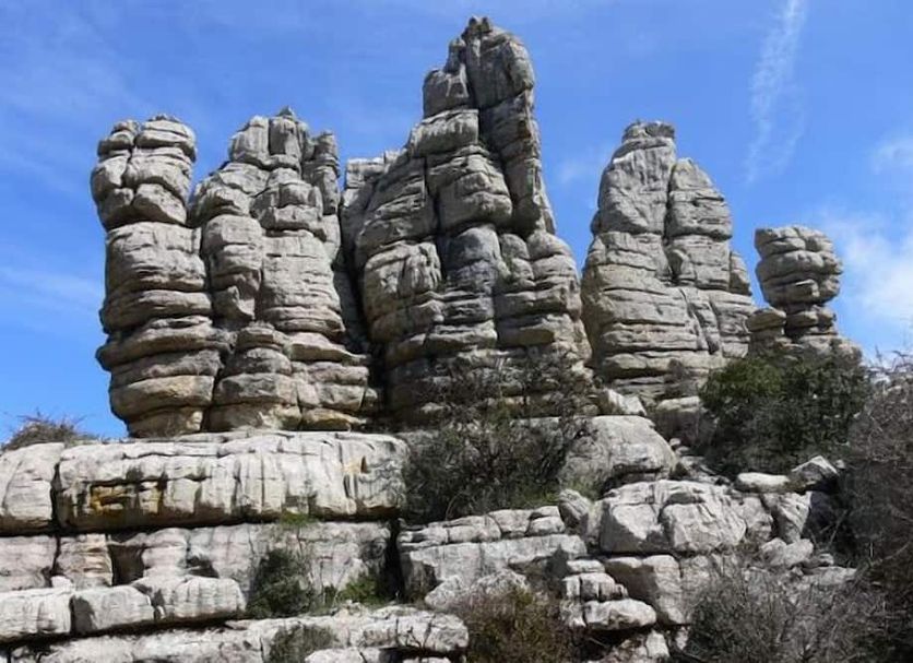 Hostal Colon Antequera in Antequera, with rocky limestone formations under a blue sky