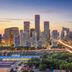 ibis Beijing Dongdaqiao in Beijing with city skyline and illuminated highway at sunset