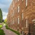 The Kimball at Temple Square in Salt Lake City: brick hotel exterior with walkway and landscaped side yard