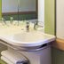 ibis budget Saint-Gratien Enghien-les-Bains bathroom sink with mirror and towel shelf