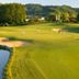 Das Eisenberg in Sankt Martin an der Raab overlooking a golf course with players and golf cart