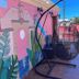 Maya Campeche Hotel in Campeche, colorful mural wall and hanging egg chair on a terrace