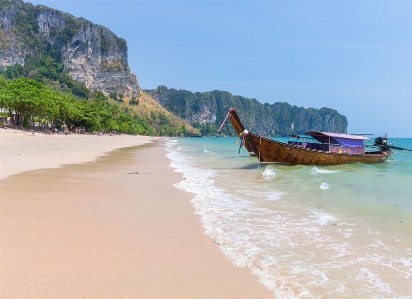 Aonang Sr Bungalow in Ao Nang with beach, longtail boat and limestone cliffs by clear sea