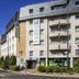 ibis budget Saint-Gratien Enghien-les-Bains exterior in Saint-Gratien on a sunny street