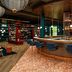 Tribe Le Touquet bar with blue stools and warm lighting in Le Touquet