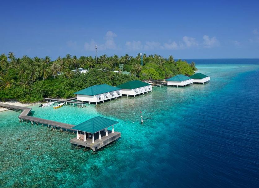 Embudu Village in Embudu with overwater bungalows and a turquoise lagoon