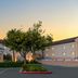 Fairfield Inn & Suites by Marriott San Francisco San Carlos exterior at sunset with entrance and parking lot