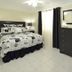 Hollywood by the Sea, Hollywood bedroom with king bed, nightstands, dresser and ceiling fan