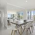 Kirra Palms Holiday Apartments in Coolangatta dining area with balcony doors and ocean view