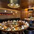 The Westin Xi'an Xi'an elegant restaurant with round table settings and warm wood interior