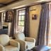Kievits Kroon Gauteng Wine Estate lounge in Pretoria with armchairs, fireplace and large windows