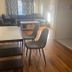 Nwk 457 Room 111-A in Newark living area with sofa, coffee table, dining table and chairs