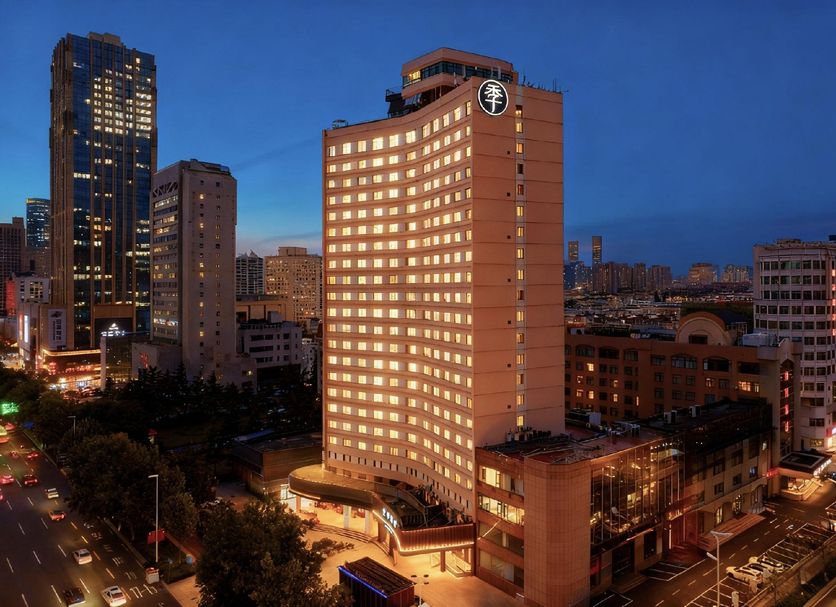 Ji Hotel Xianggang Middle Road Qingdao at night, city skyline and illuminated high-rise exterior in Qingdao