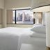 Sheraton Lincoln Harbor Hotel in Weehawken room with bed and skyline views through large windows