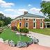 Hilton Vacation Club Greensprings Williamsburg exterior with putting green, basketball court and landscaped grounds