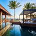 Constance Belle Mare Plage in Belle Mare with oceanfront poolside cabanas and palm trees