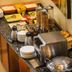 StayEasy Pretoria breakfast buffet with cereal dispensers, toast, jam, and stacked plates